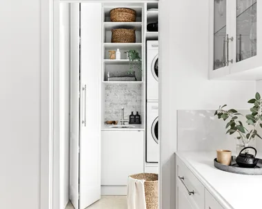 White laundry next to modern white kitchen