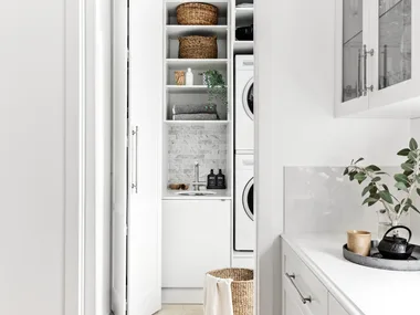 White laundry next to modern white kitchen
