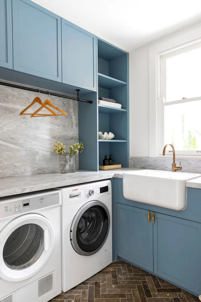 Blue laundry with marble splashback