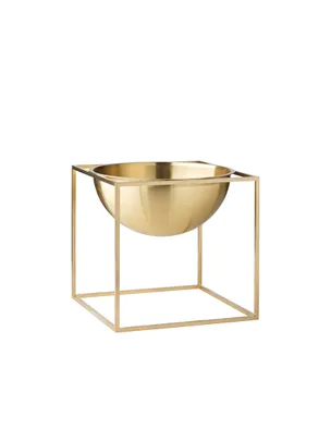 Golden bowl with a geometric square frame stand against a white background.