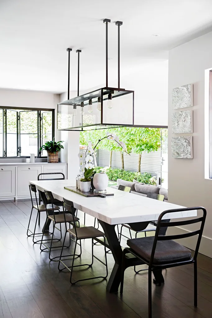 A three-metre marble-topped dining table, designed by Rachel and made by Camargue, is the stunning show stopper in the dining room