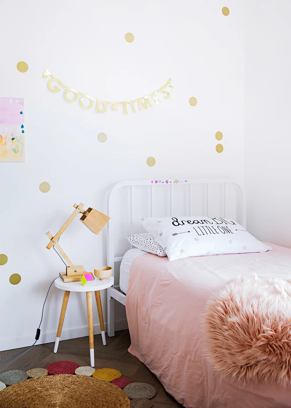 Soft pink and neutral tones in kids' bedroom