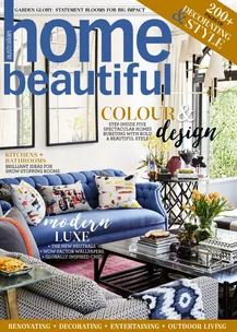 Cover of "Australian Home Beautiful" magazine featuring colorful living room design with blue sofa.