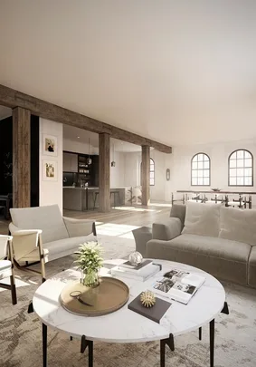 Modern, open living room with neutral tones, featuring large windows, exposed beams, and a round marble coffee table.