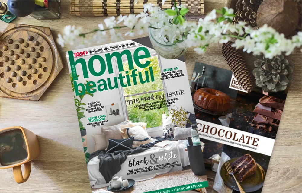 Magazines on a table: "Home Beautiful" focusing on home decor and a chocolate-themed issue, surrounded by pinecones and flowers.