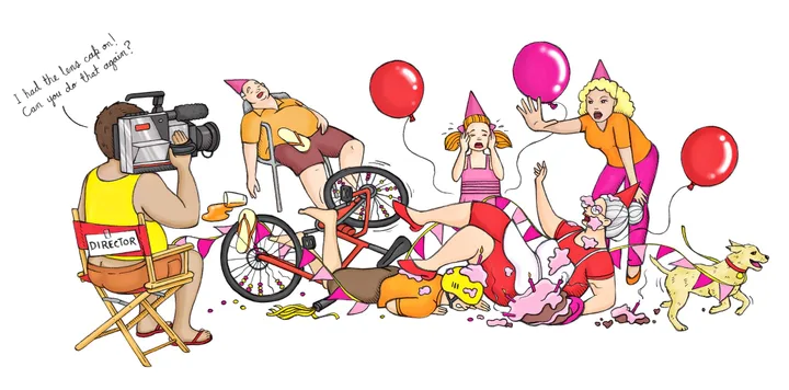 Director filming chaos with fallen bicycle, cake, balloons, and party hats; speech bubble says lens cap was on.