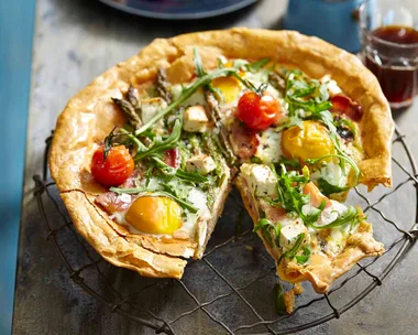 Breakfast tart with eggs, feta, rocket and cherry tomatoes