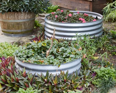 two raised garden beds made out of corrugated iron