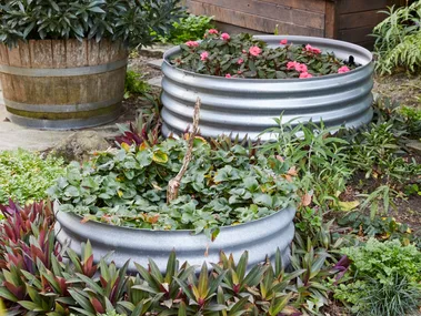 two raised garden beds made out of corrugated iron