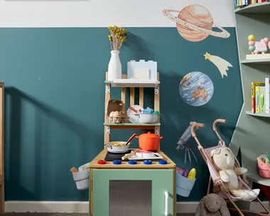 kids play kitchen long shot with chair converted into play equipment in centre