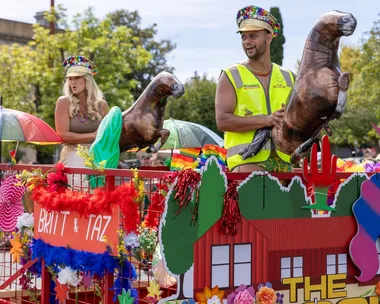 Britt and Taz contestants on The Block 2025 on a float in Daylesford