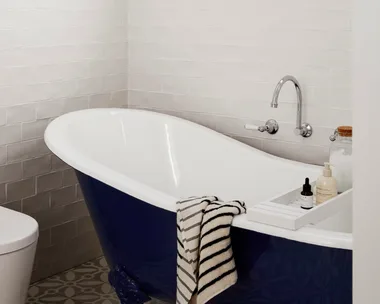 Classic black and white bathroom with claw-foot bath tub