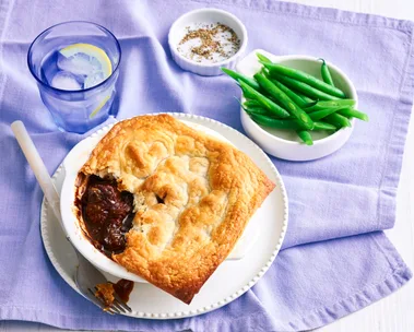 pie for one with spoon cut out of it on a purple tablecloth