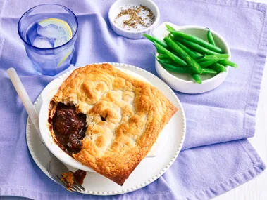 pie for one with spoon cut out of it on a purple tablecloth