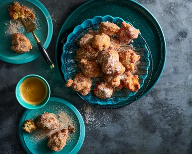 banana doughnuts in blue bowl piled up