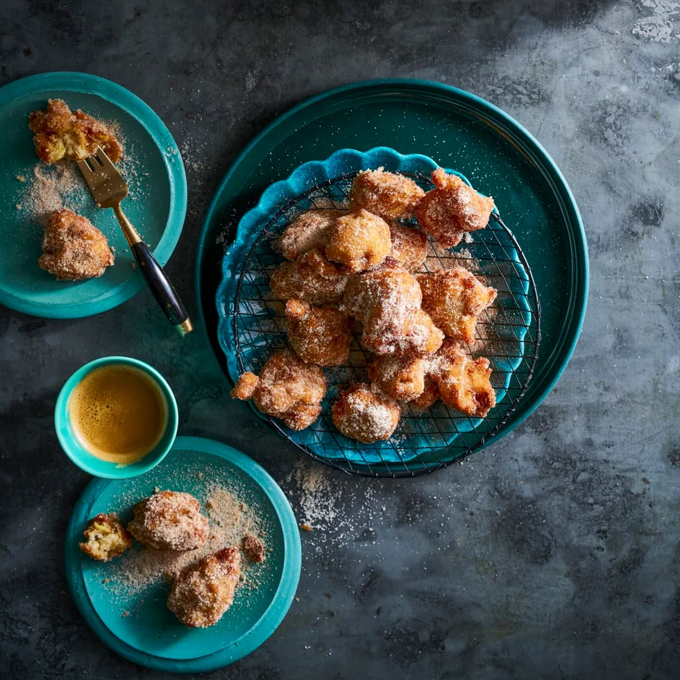 banana doughnuts in blue bowl piled up