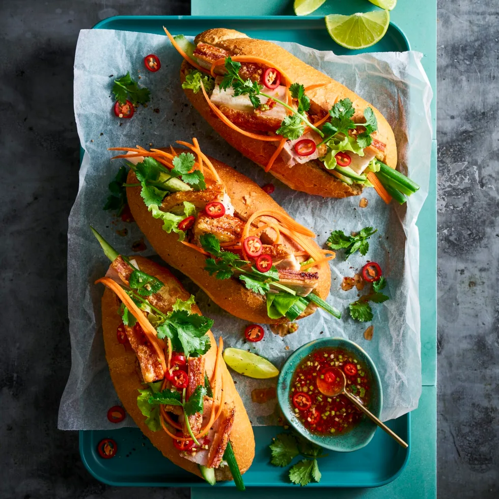 banh mi 3 rolls with pickled carrot pork belly and coriander on top