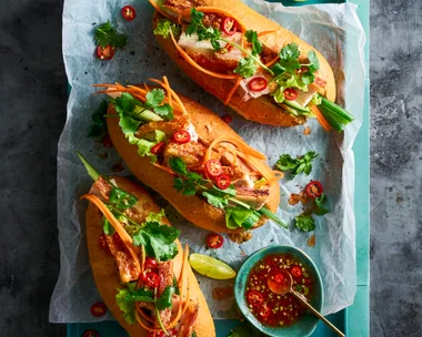 banh mi 3 rolls with pickled carrot pork belly and coriander on top
