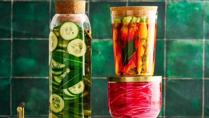 pickle recipe with cucumber pickles, carrot pickles and pickled onions in three separate jars