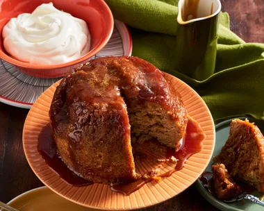 steamed pudding made in the microwave on orange plate