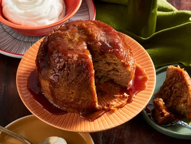 steamed pudding made in the microwave on orange plate