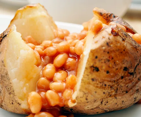 Baked beans topping on a baked potato