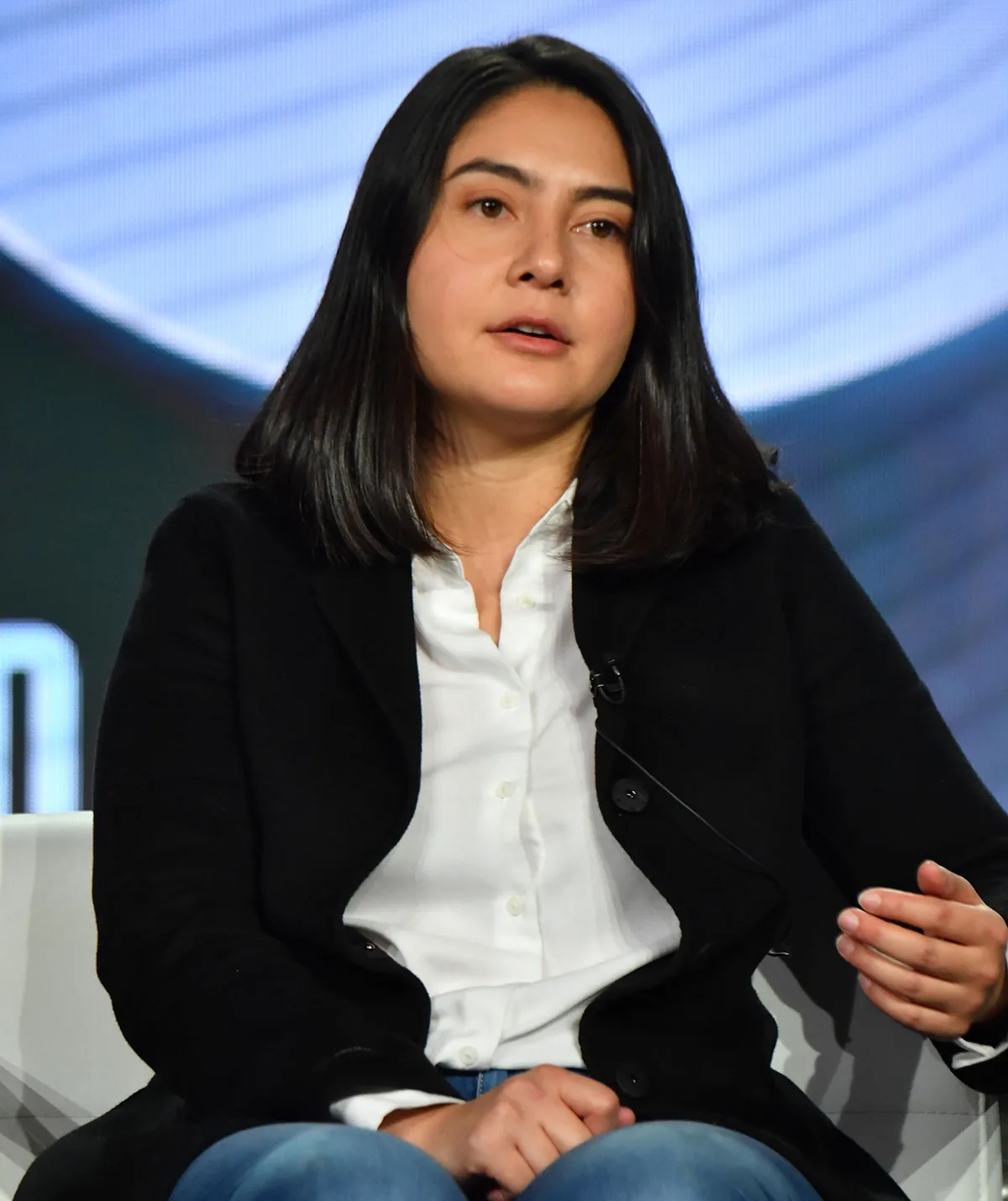 Erika speaking at a conference about her experience with Theranos