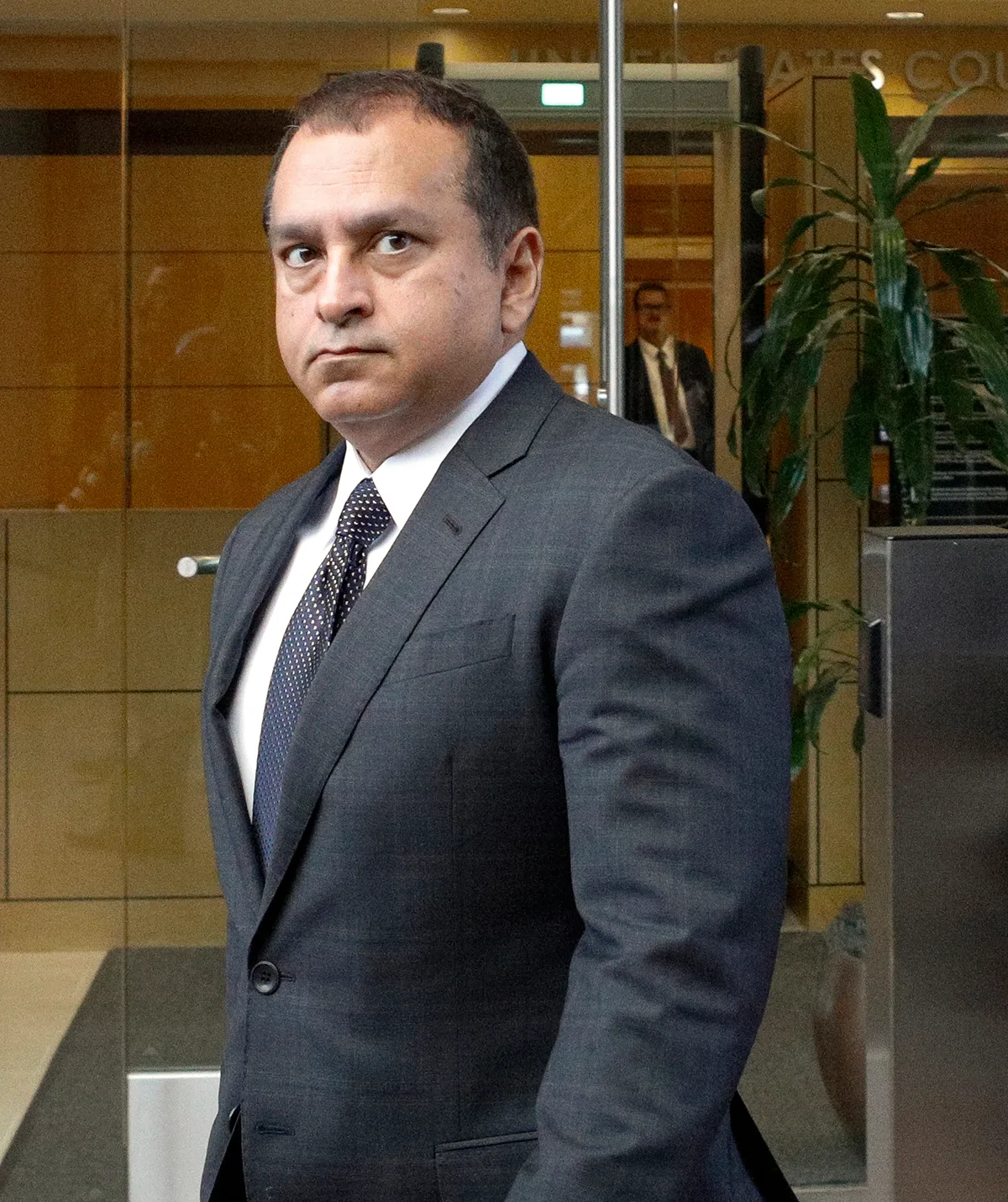 Theranos' Chief Operating Officer, Ramesh "Sunny" Balwani, former lover of Elizabeth Holmes outside a courthouse.