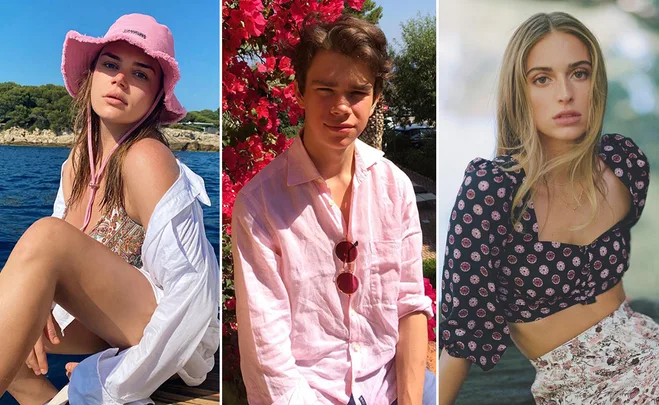 Three people outdoors: a woman in a pink hat by the sea, a man in a pink shirt with flowers, and a woman in a patterned top.