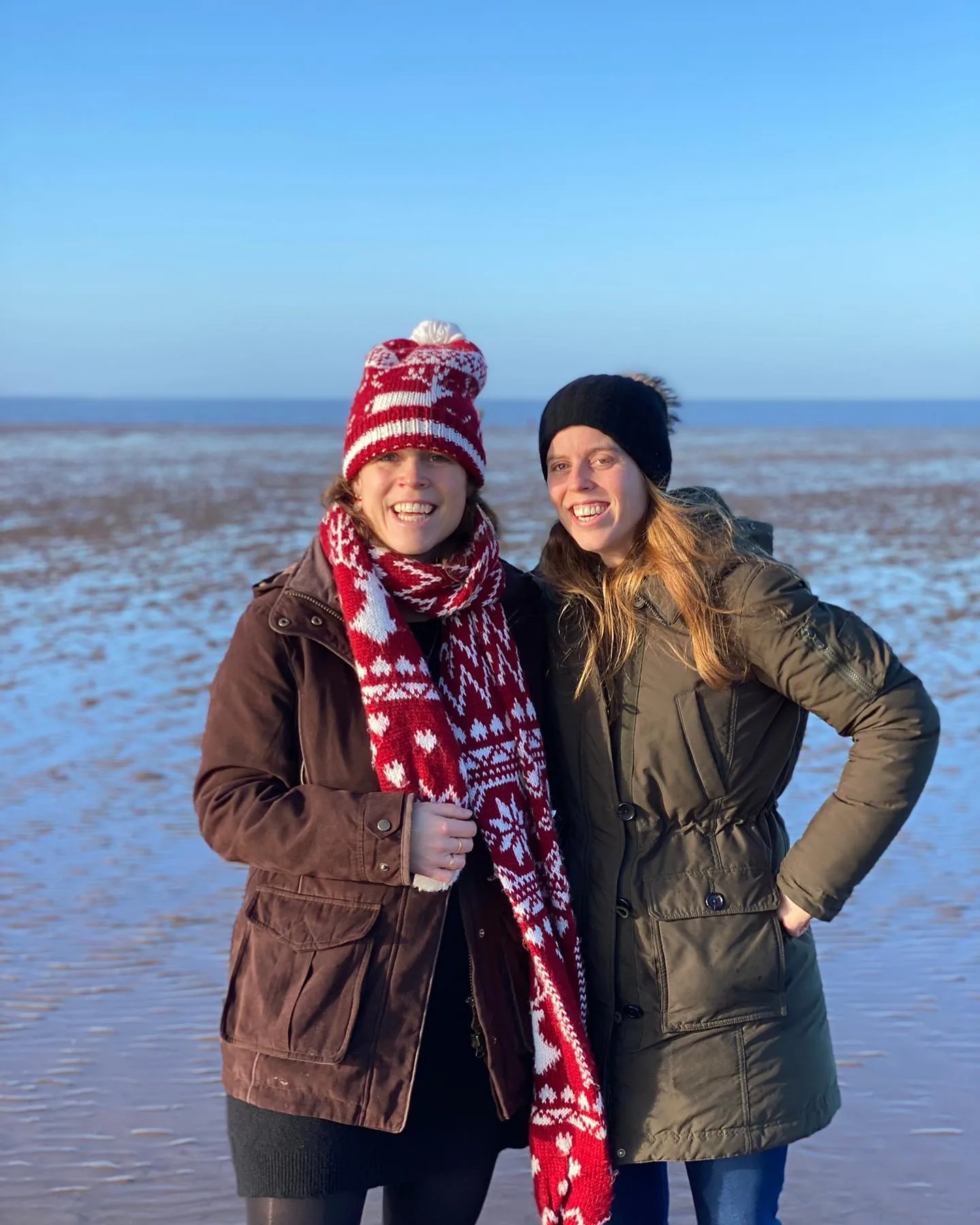 The sisters smiling. 