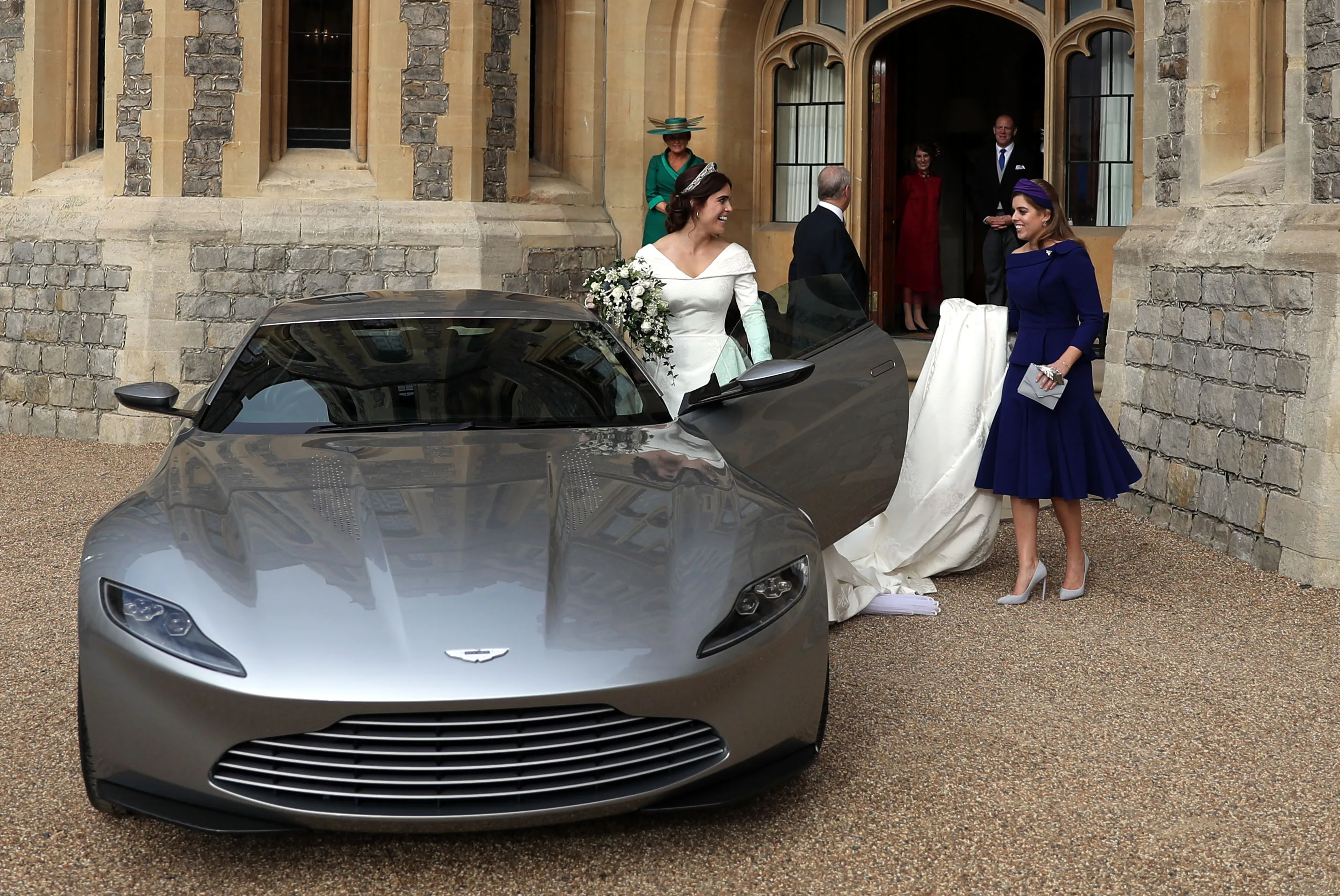 Princess Eugenie, Jack Brooksbank, Princess Beatrice and Prince Andrew, Duke of York leave Windsor Castle in an Aston Martin DB10 after Eugenie and Jack's wedding. 