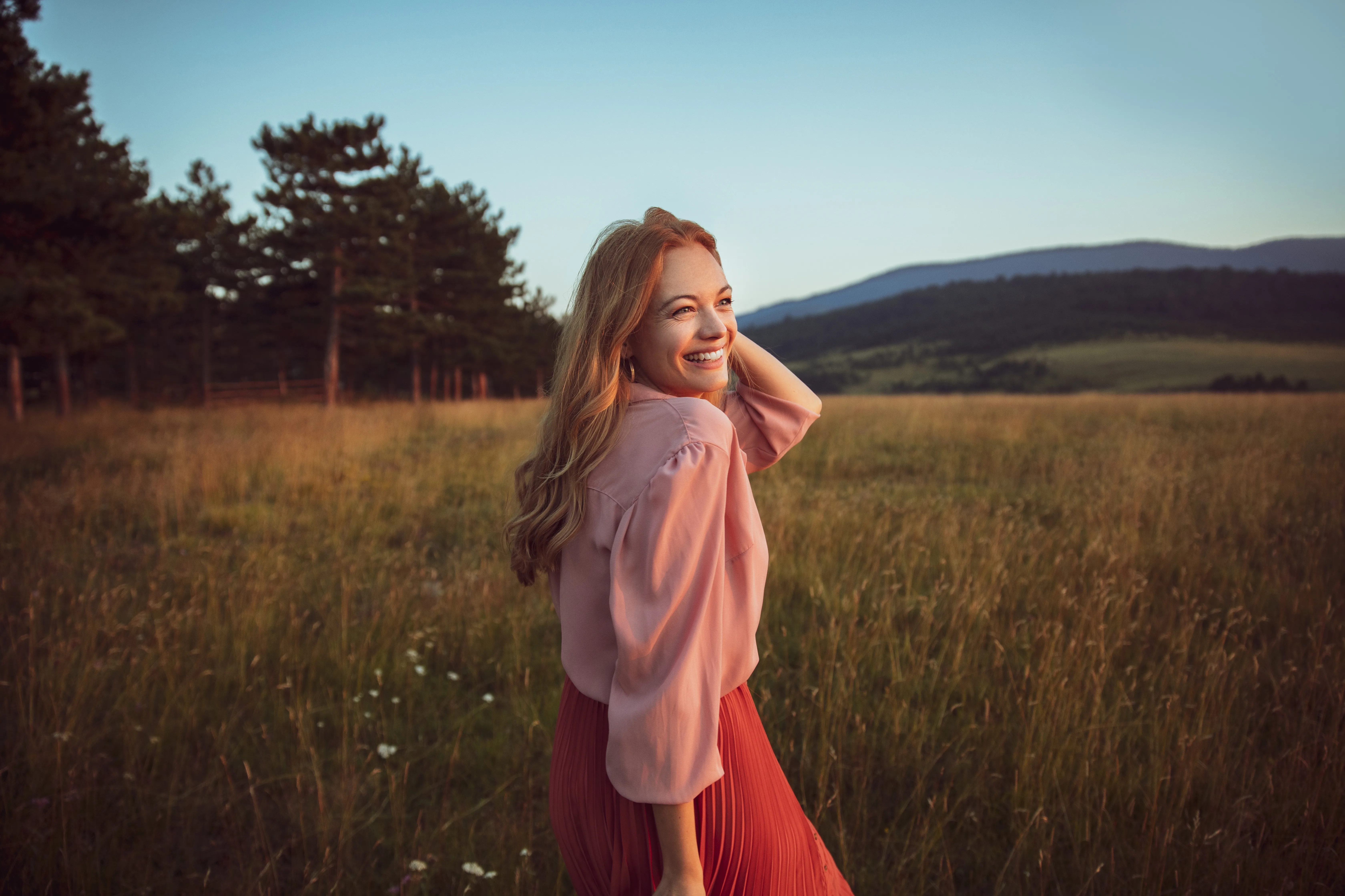 Close up of a beautiful woman having a walk in the forest