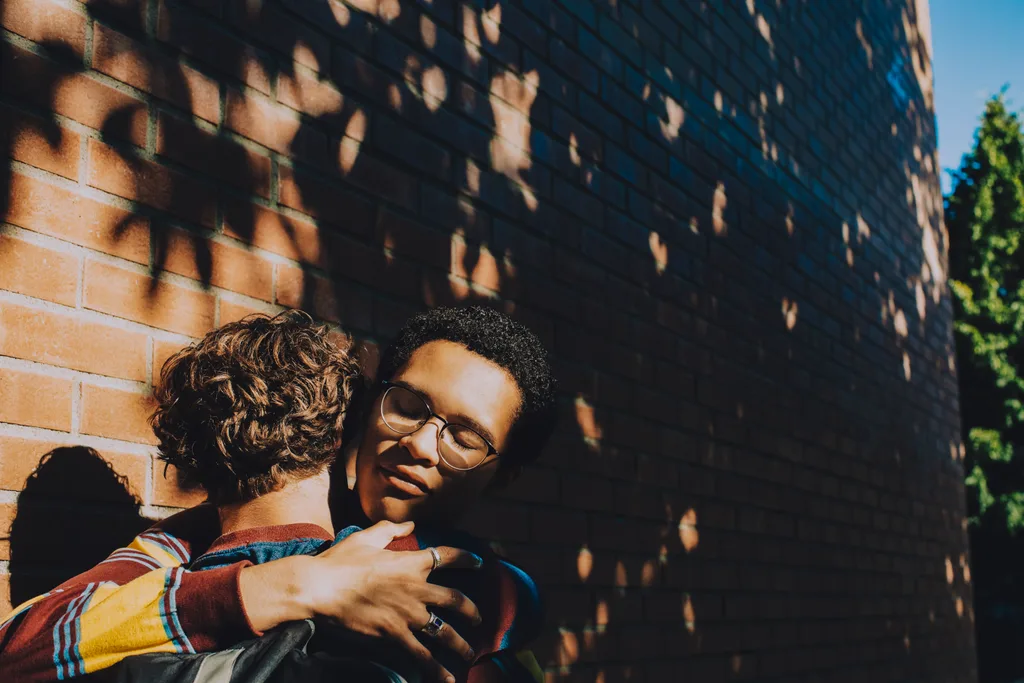 two boys hugging.