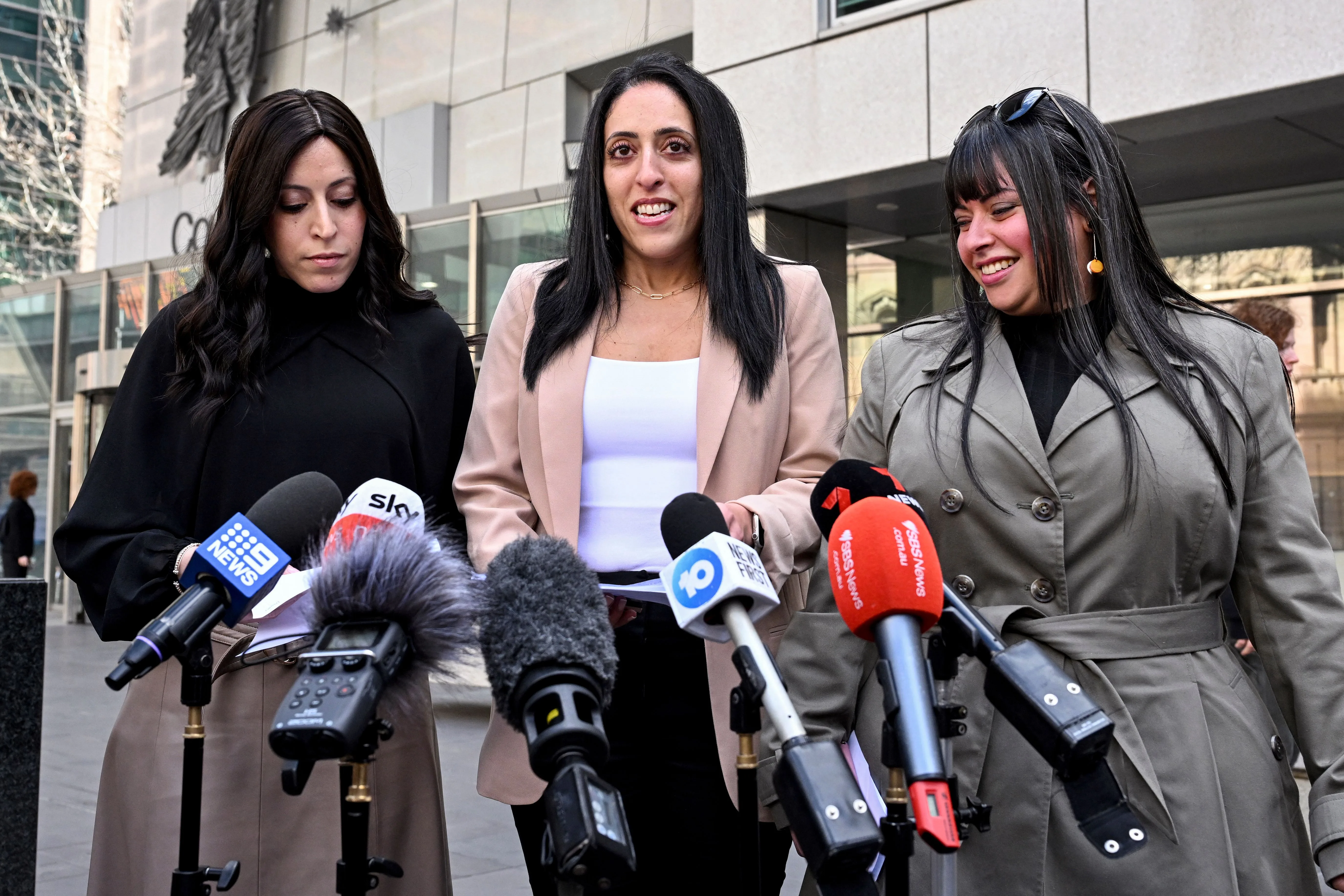 (L-R) Sisters Nicole Meyer, Elly Sapper, and Dassi Erlich speak to the media outside the County Court in Melbourne on August 24, 2023 after ex-headmistress Malka Leifer was sentenced to 15 years in jail for sexually abusing Dassi and Elly at an Australian Jewish school, before fleeing to Israel then being extradited back. (Photo by William WEST / AFP) (Photo by WILLIAM WEST/AFP via Getty Images)