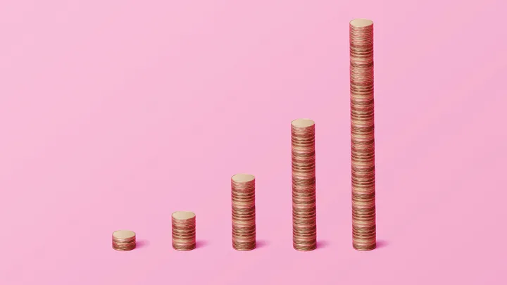 A row of stacked coins to represent money growing.