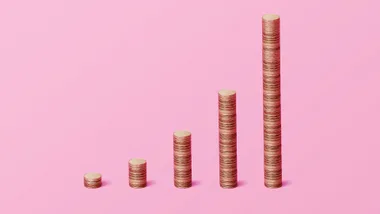 A row of stacked coins to represent money growing.