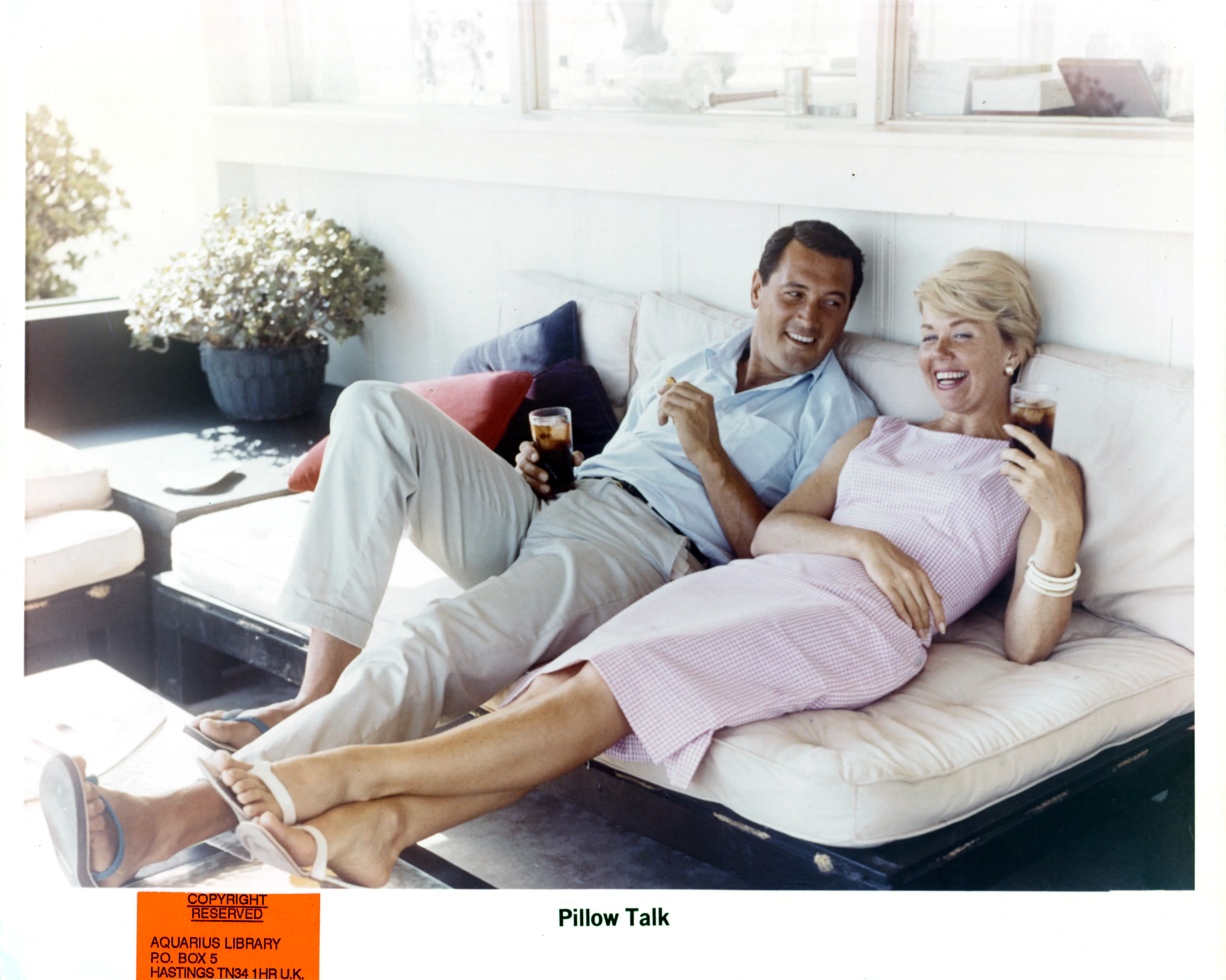 Rock Hudson and Doris Day relax on set of the film 'Pillow Talk', 1959. (Photo by Universal/Getty Images)
