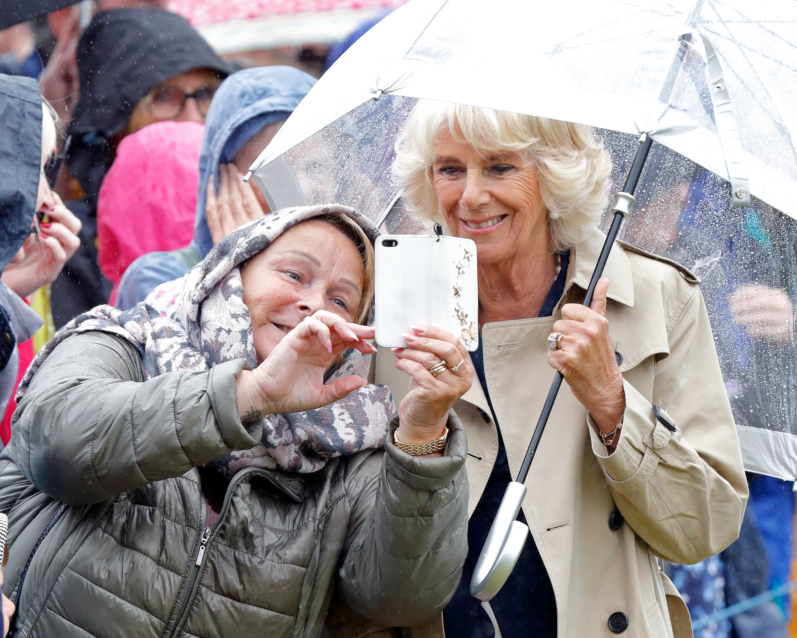 Queen Camilla poses for royal selfies.