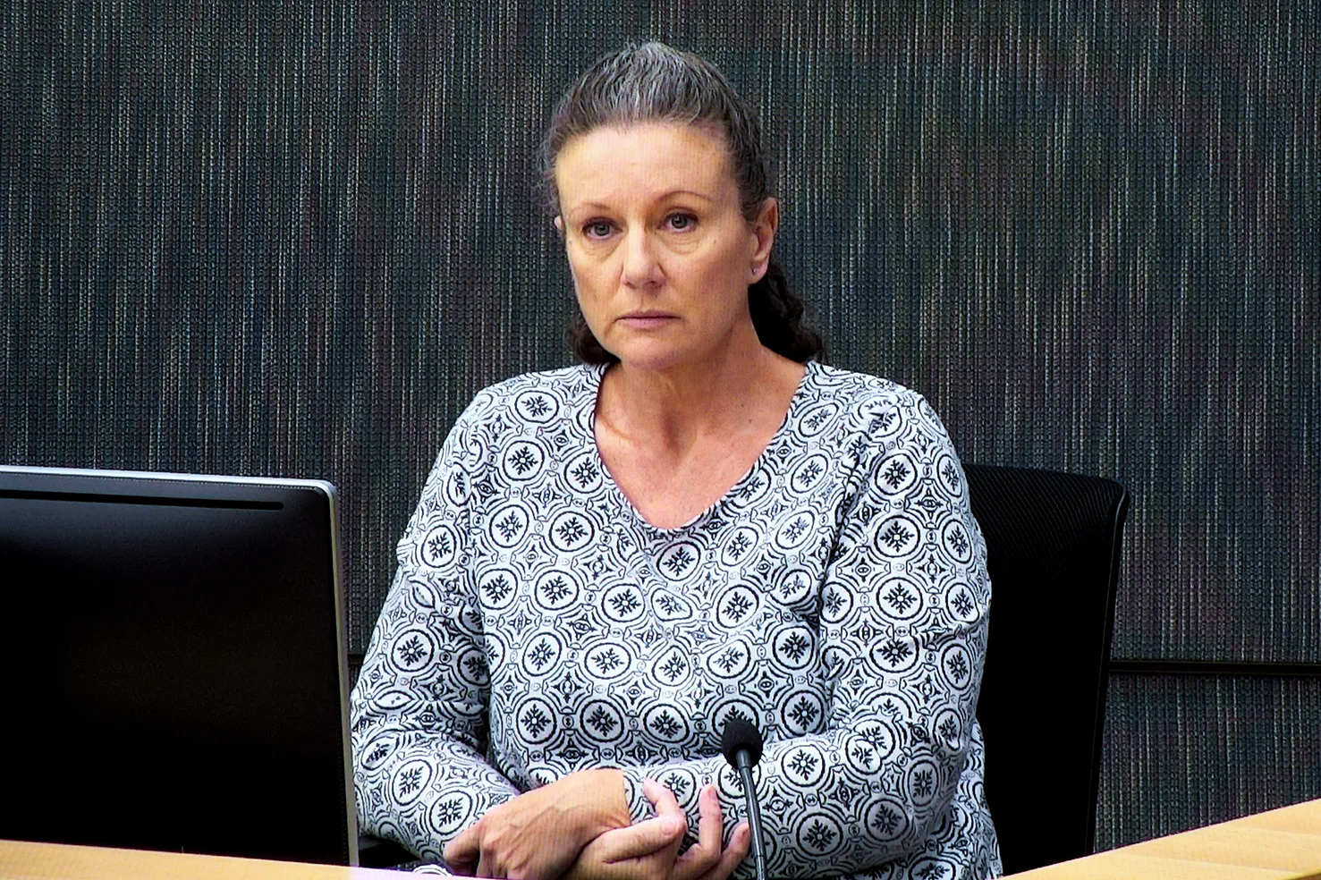 Kathleen Folbigg appears via video link during a convictions inquiry at the NSW Coroners Court, Sydney, Wednesday, May 1, 2019. An Inquiry continues into convictions of "baby killer" Kathleen Megan Folbigg. (AAP Image/Joel Carrett) NO ARCHIVING