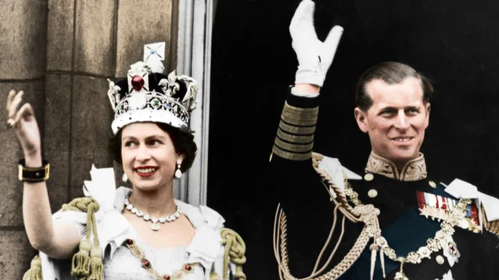 Queen Elizabeth II and the Duke of Edinburgh on the day of their coronation, Buckingham Palace, 1953. (Colorised black and white print). Artist Unknown. (Photo by The Print Collector/Getty Images)