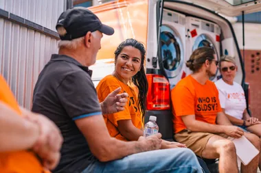 Volunteers smiling.