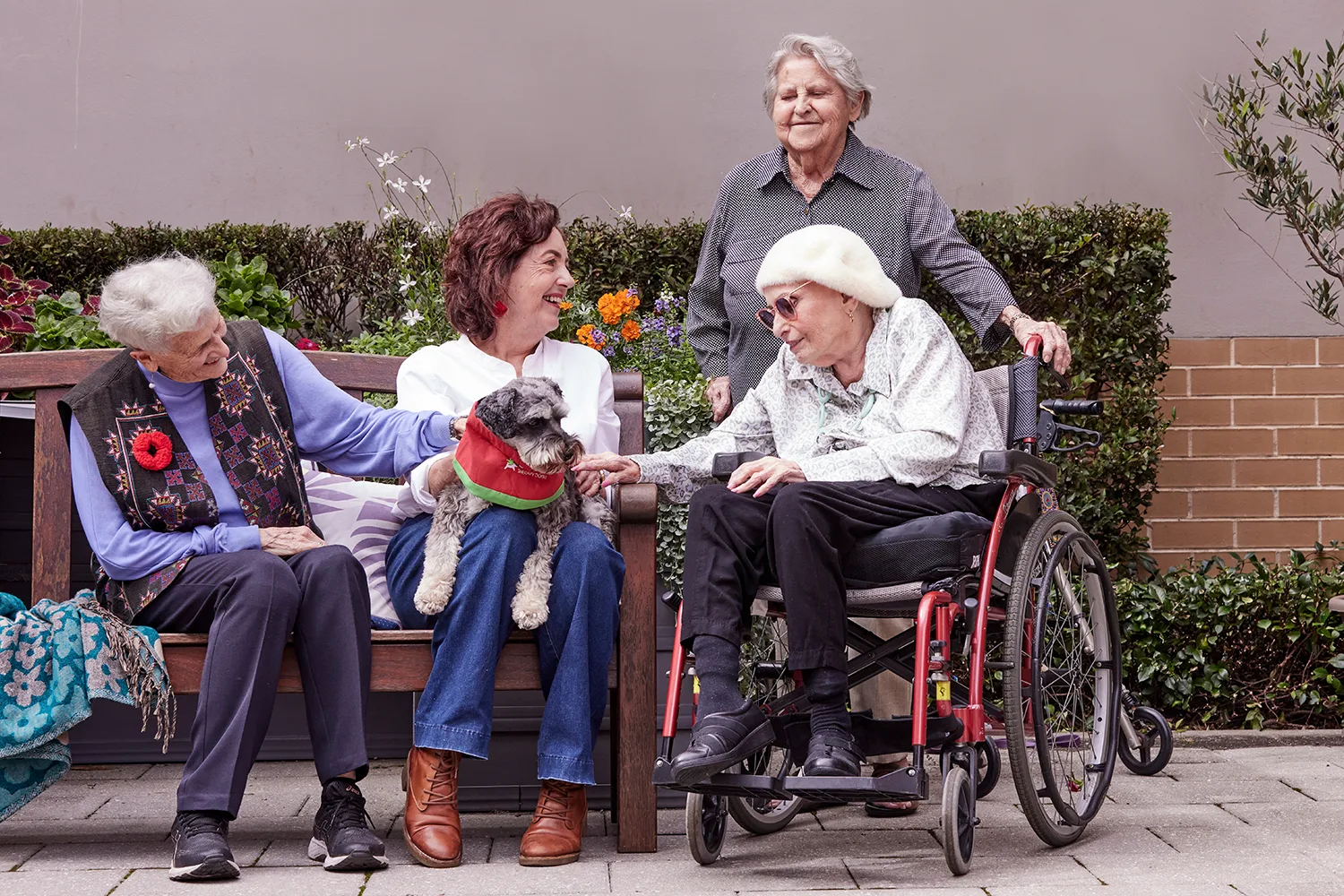 An elderly woman and volunteers.