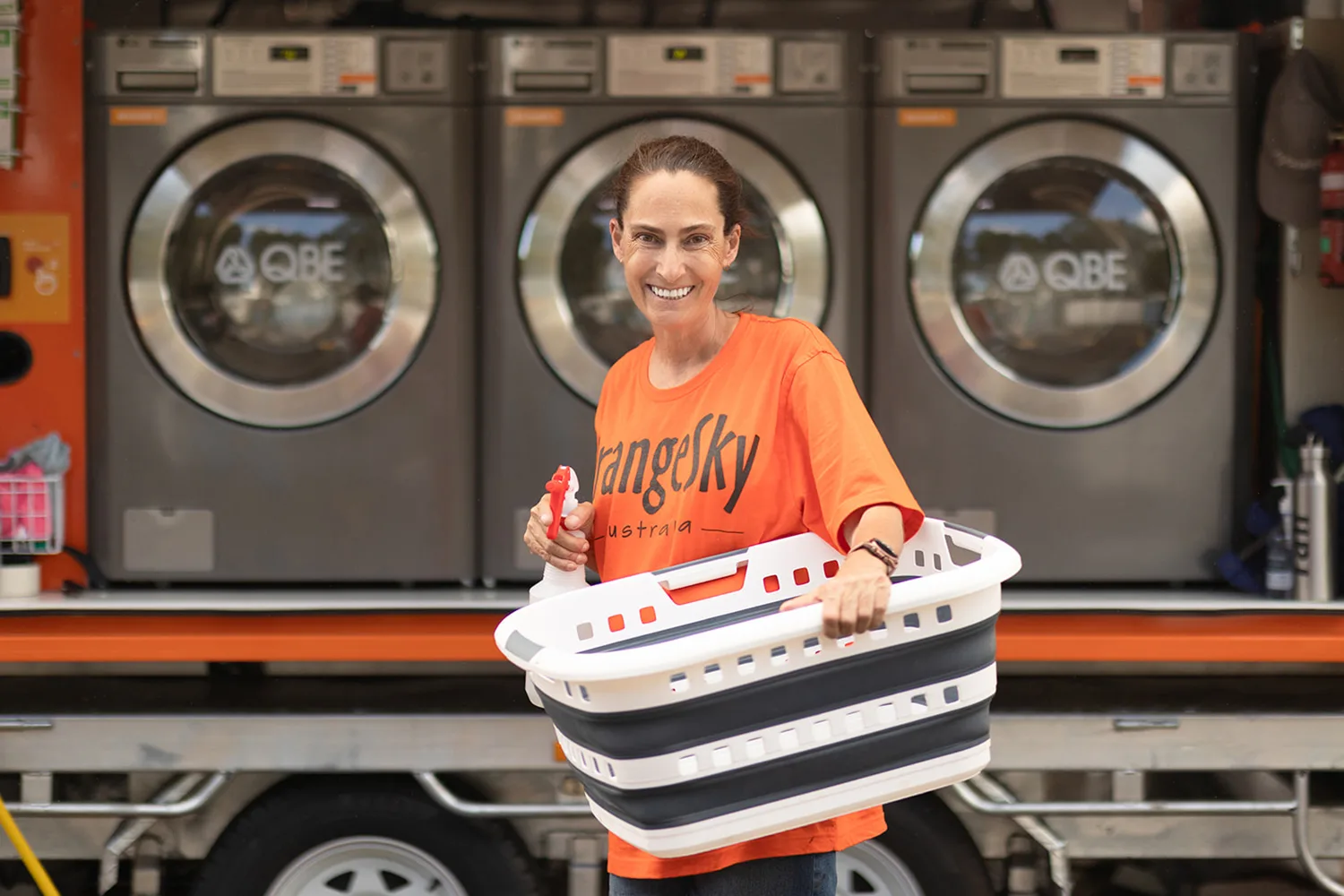 A volunteer at a laundromat.