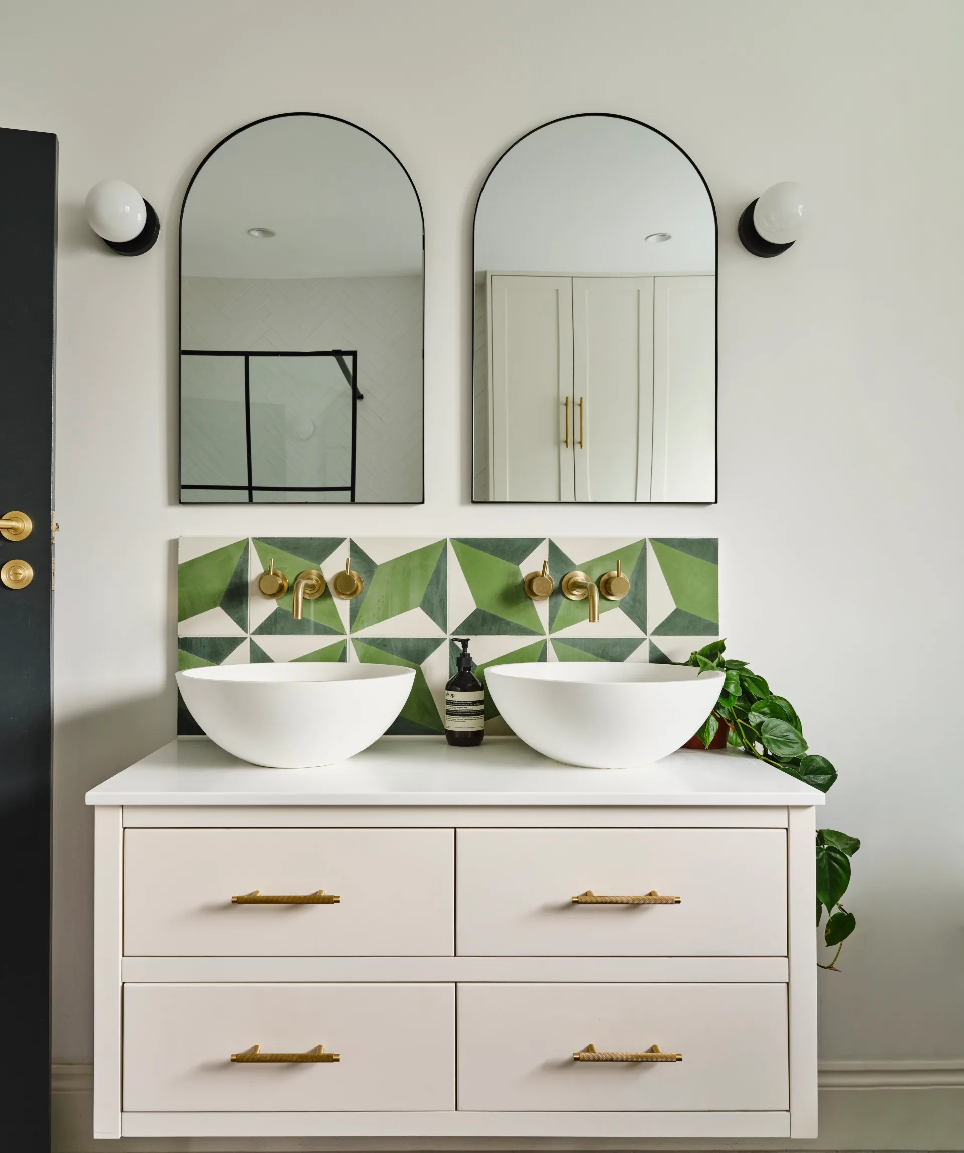 Modern bathroom counter with two basins and two mirrors