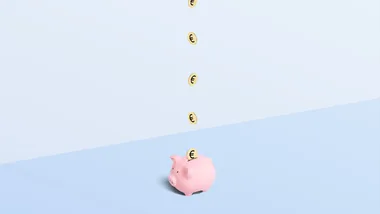 Pink piggy bank catching falling euro coins on a blue background.