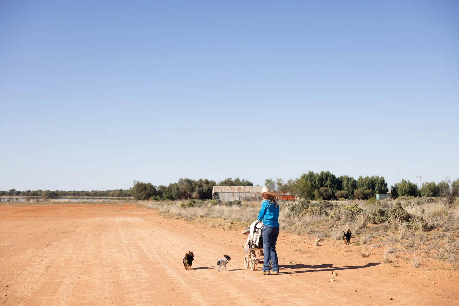 The flying vet Ameliah Scott pushed stroller down a dirt path.