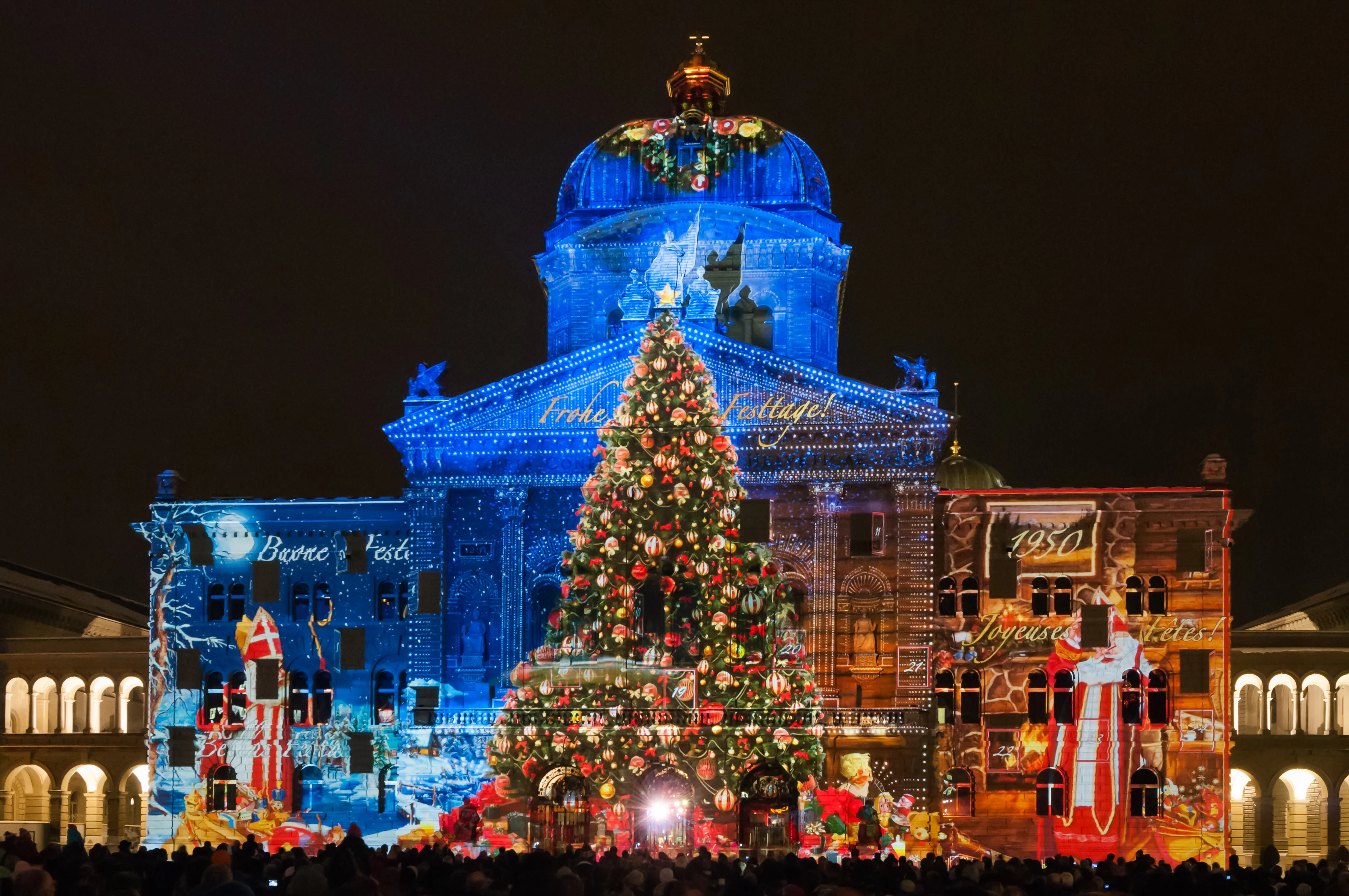 Bern, Switzerland - December 14, 2012: The contours of the Federal Palace of Switzerland (Bundeshaus) are retraced with projected light spots during the performance of the sound and light show \"Rendez-vous Bundesplatz\".