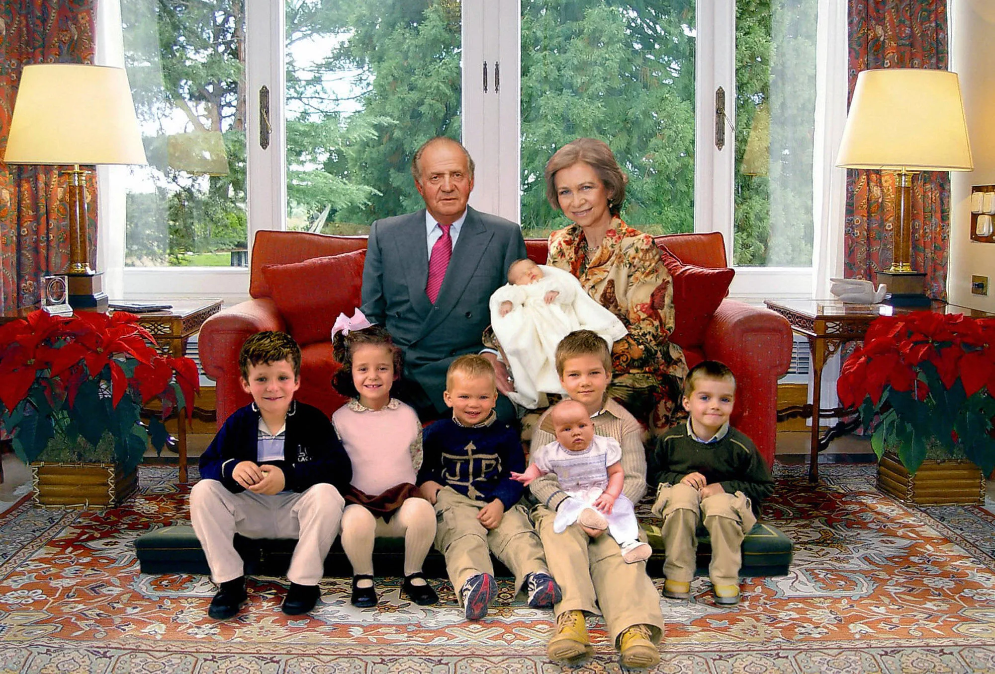 Picture released 22 December 2005 by the Spanish Royal House shows Spanish King Juan Carlos (top L) and Queen Sofia, holding their newborn grandchild Leonor, posing with all their grandchildren (from L) Felipe Juan Froilan, Victoria Eugenia, Miguel, Juan holding his sister Irene and Pablo, for a Christmas greeting card. The picture is at the center of a polemic, as Spanish daily El Mundo says it is a combo pictures.    AFP PHOTO/SPANISH ROYAL HOUSE/HO  (Photo credit should read STR/AFP via Getty Images)
