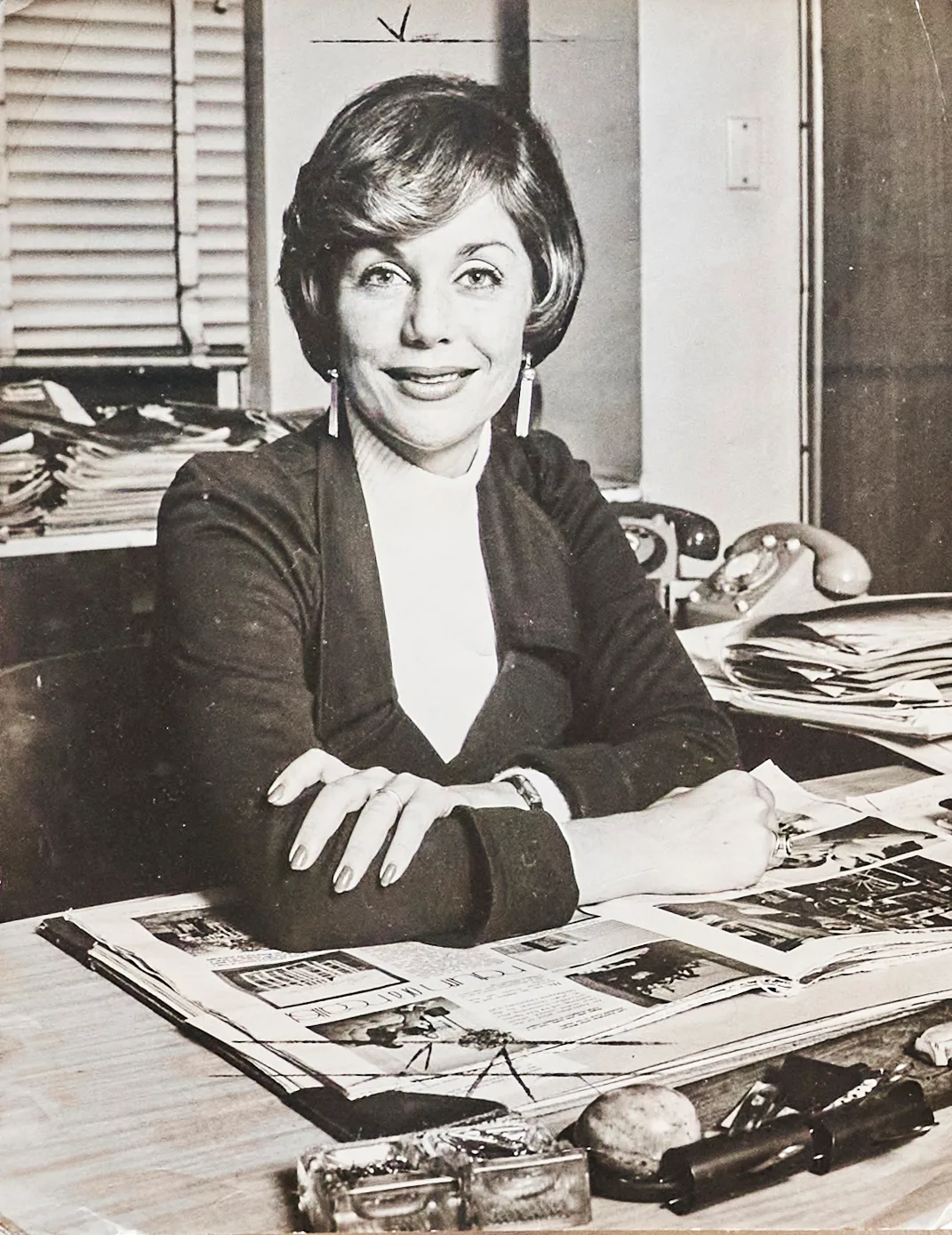 ITA BUTTROSE at desk