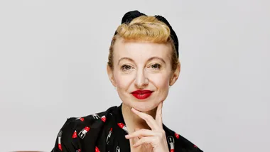 Poppy King wearing red lipstick